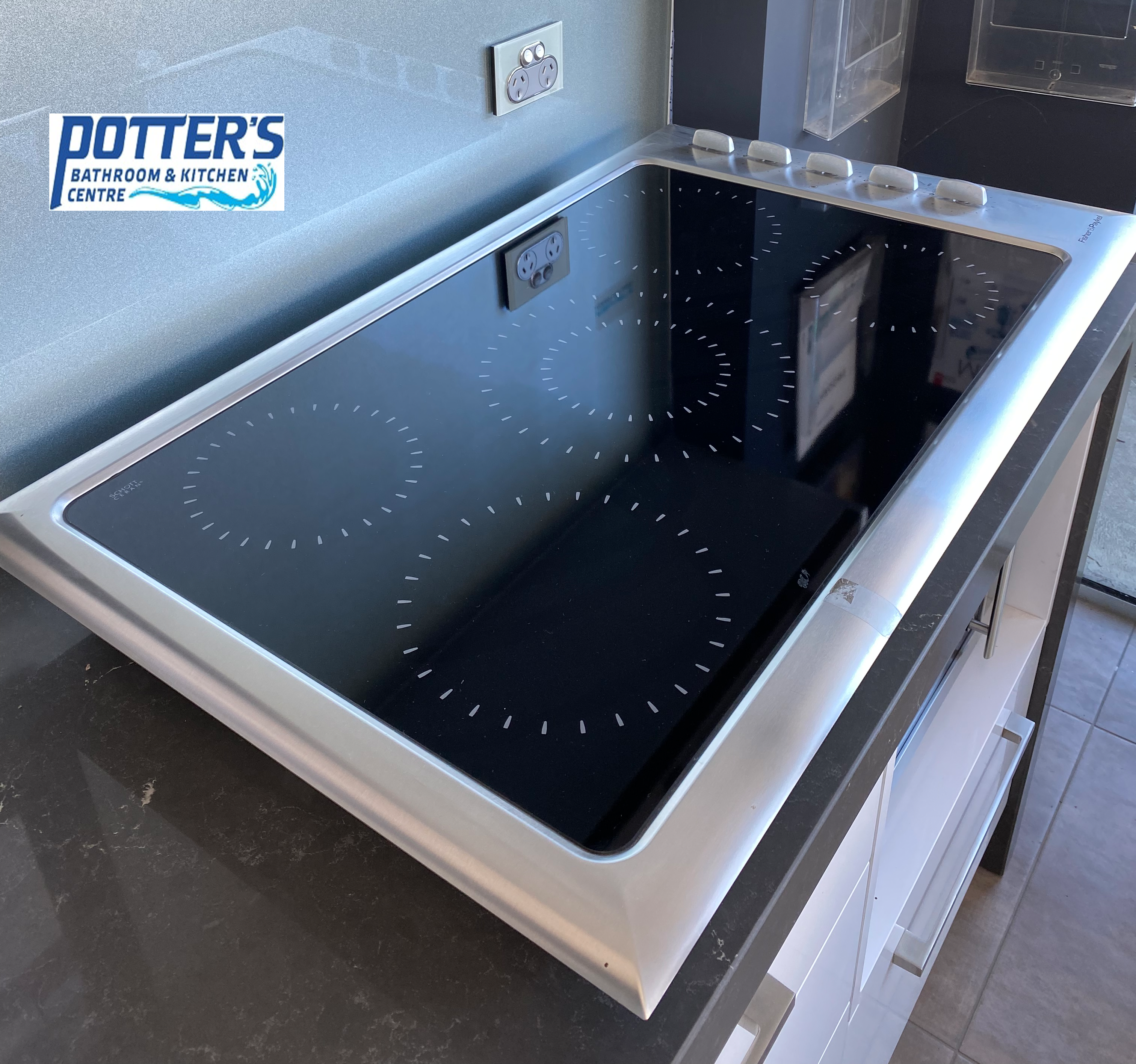 ff.png Fisher and Paykel Electric Cooktop Black With Stainless Trim Model CE901 - Image 1